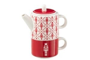 Rot-weiße Teekanne mit Nussknacker-Design.
