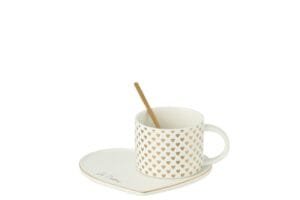 Weiße Tasse mit Herzmotiven, goldener Löffel und herzförmiger Unterteller.